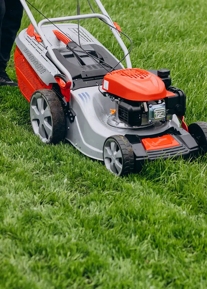 man-cutting-grass-with-lawn-mover-back-yard